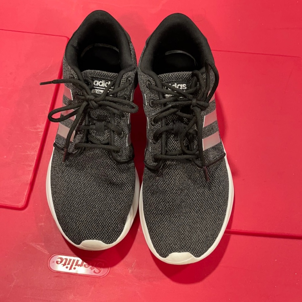Dark grey and silver adidas running shoes
